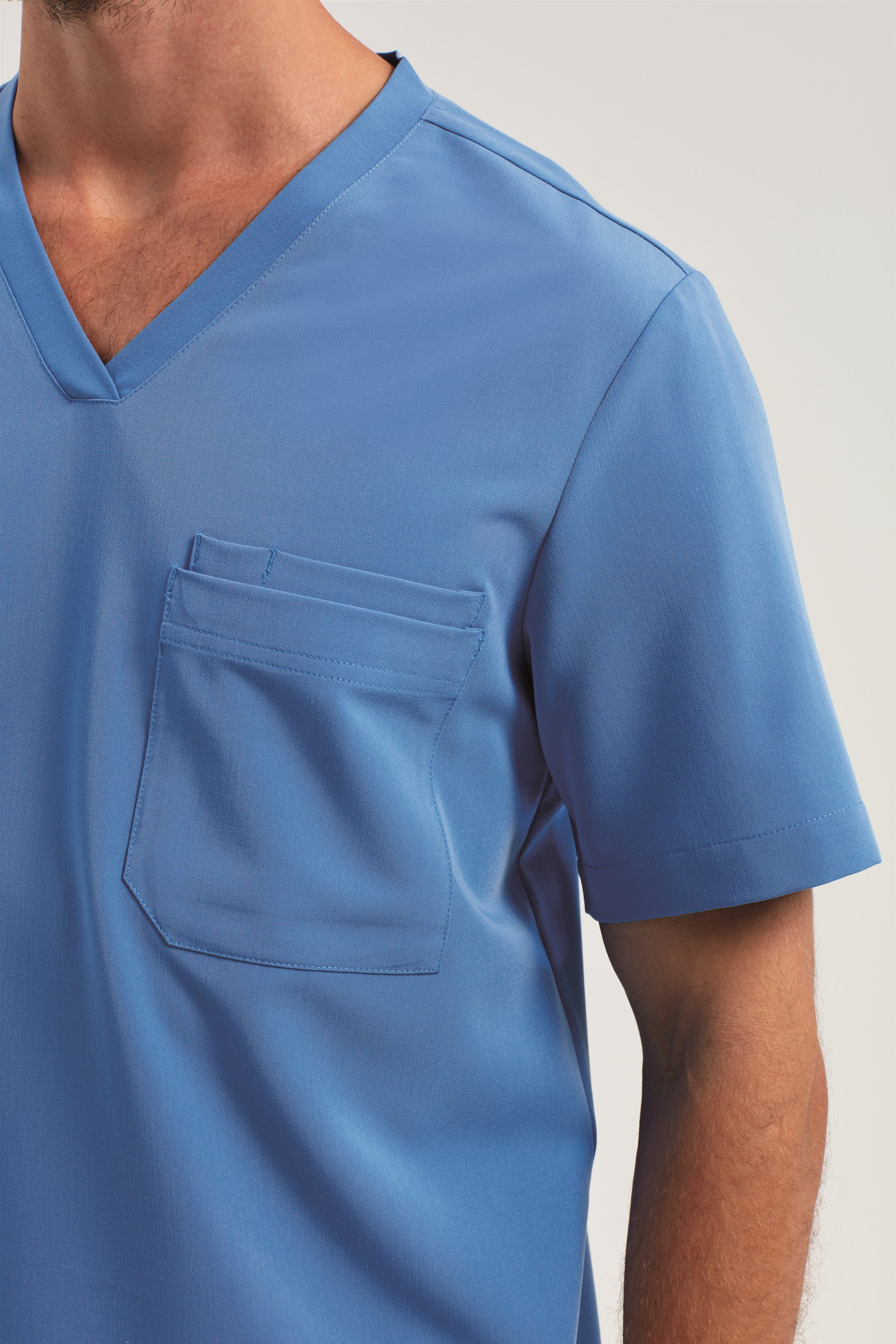 Divisa Mediswear Ceil Blue personalizzata con logo studio — servizio Brandable
